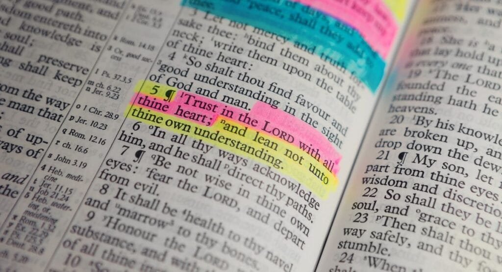 An open Bible with highlighted verses for Wednesday blessings and prayers.